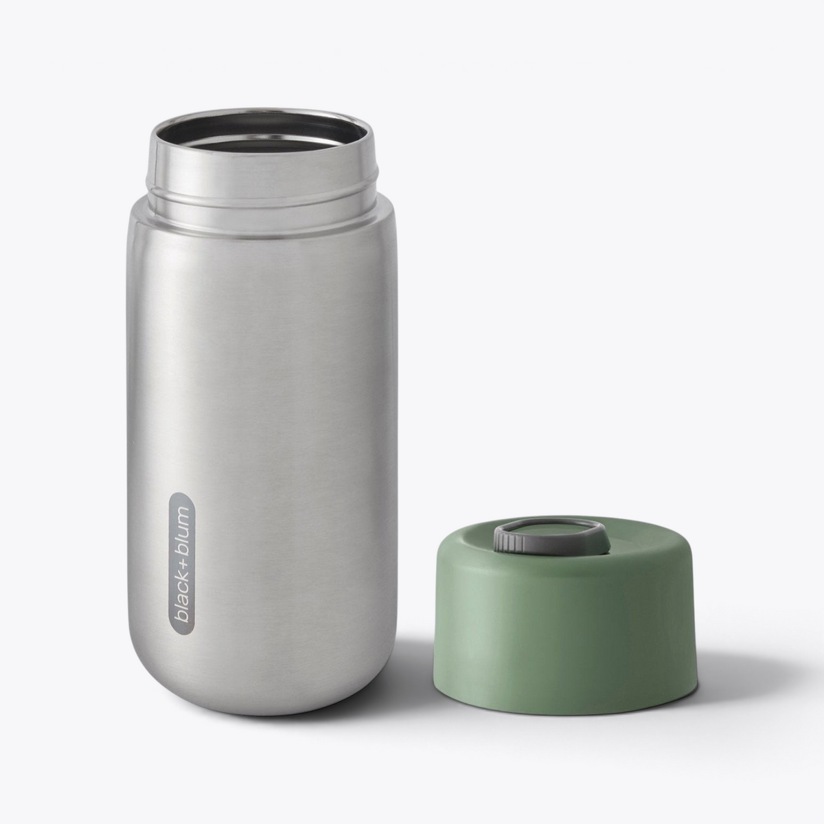 Gobelet isotherme Black+Blum vert ouvert, couvercle retiré