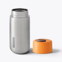 Gobelet isotherme Black+Blum orange ouvert, couvercle retiré