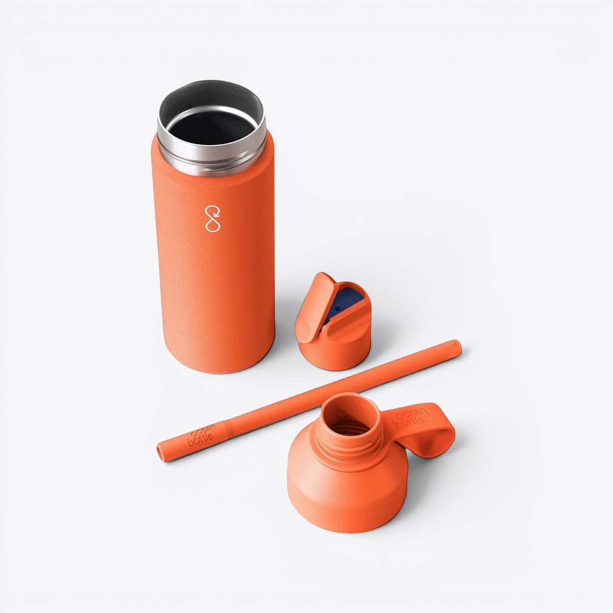 Bouteille 3-en-1 Ocean Bottle orange démontée avec bouchon, paille et module inférieur
