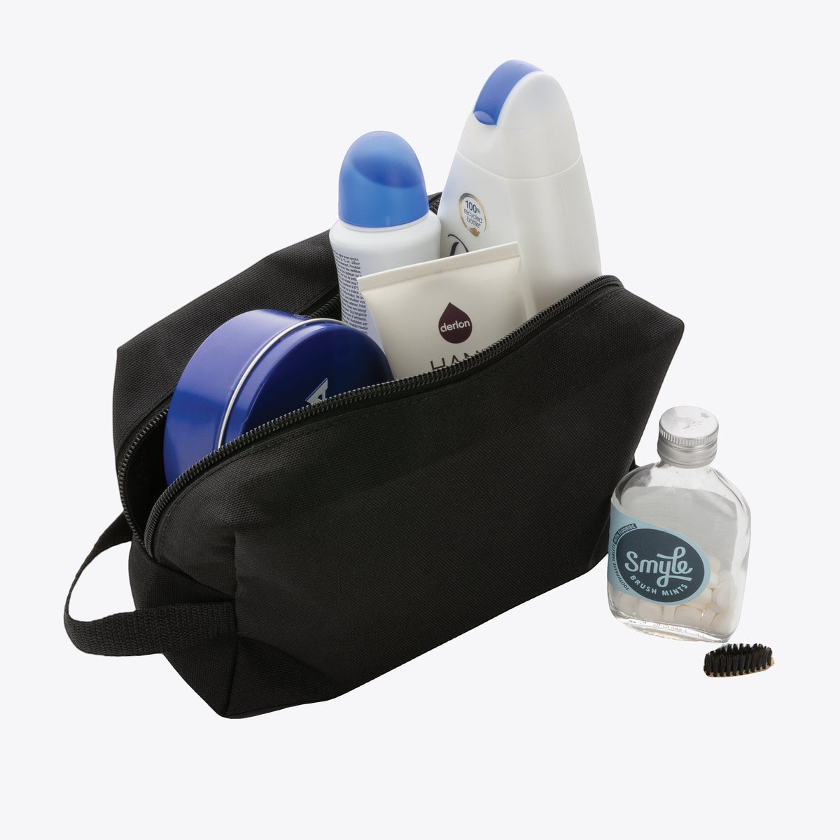 Trousse de toilette noire ouverte avec flacons et accessoires