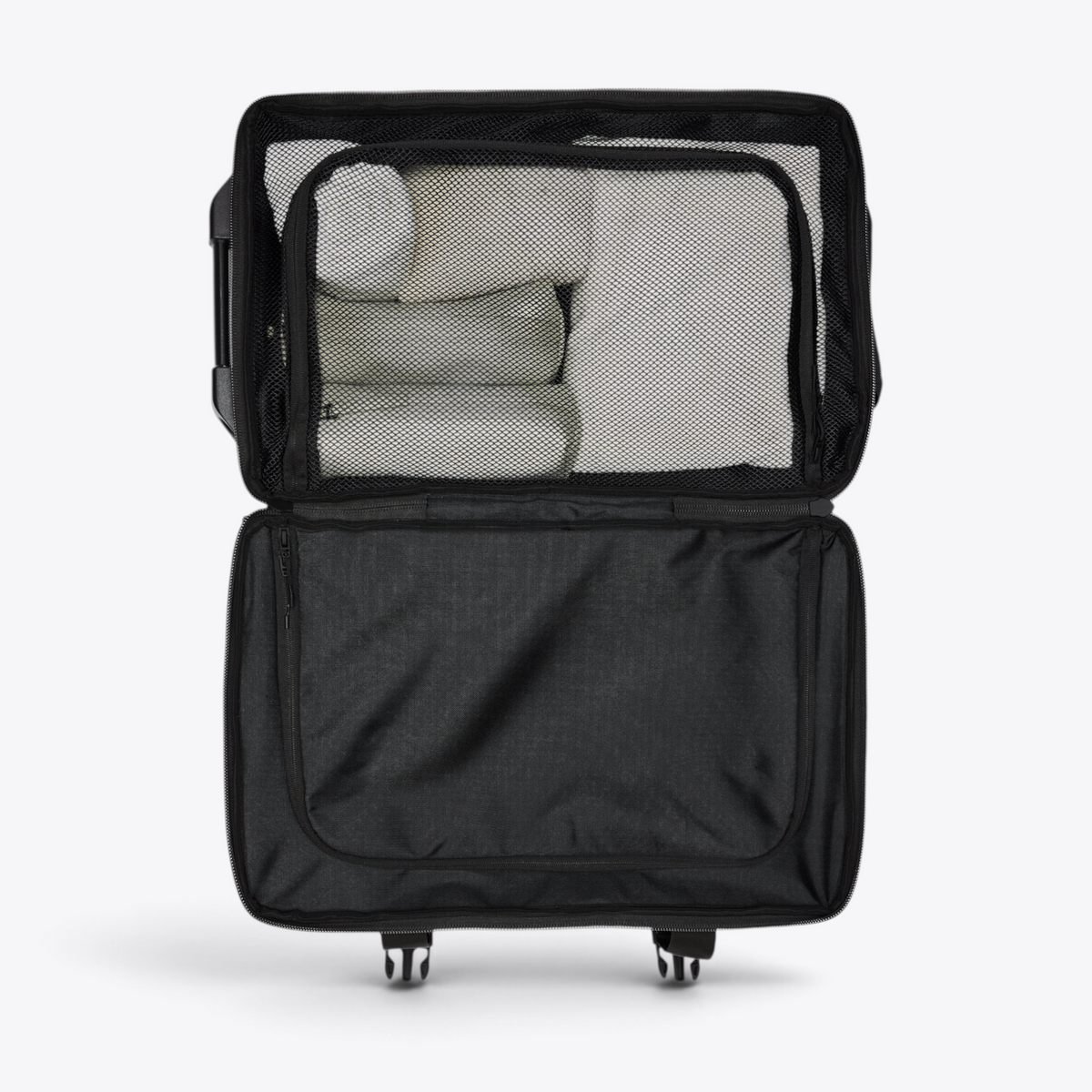 Intérieur de la valise cabine Texel Cabin Bag RAINS avec compartiment sous filet