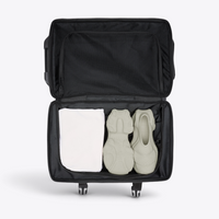 Intérieur de la valise cabine Texel Cabin Bag RAINS avec compartiment inférieur ouvert
