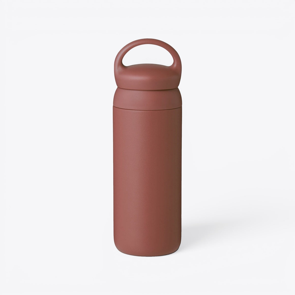 TODAY MERCH opaque Kinto bottle in terracotta red with a matte finish and a convenient carrying handle.