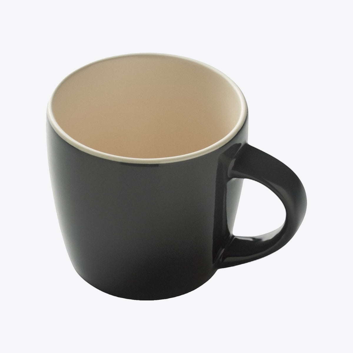 Tasse en céramique noire avec intérieur crème, vue plongeante