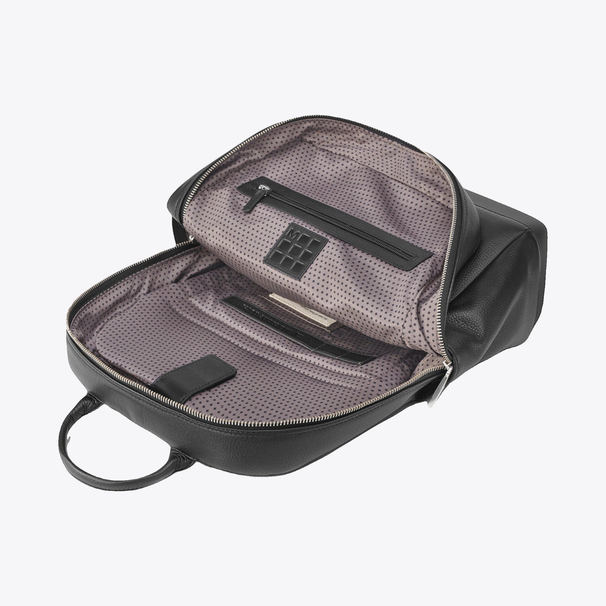 Sac à dos Moleskine en cuir noir ouvert montrant ses compartiments intérieurs