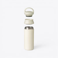TODAY MERCH opaque Kinto bottle in cream, disassembled to show lid, collar, and stainless steel interior.